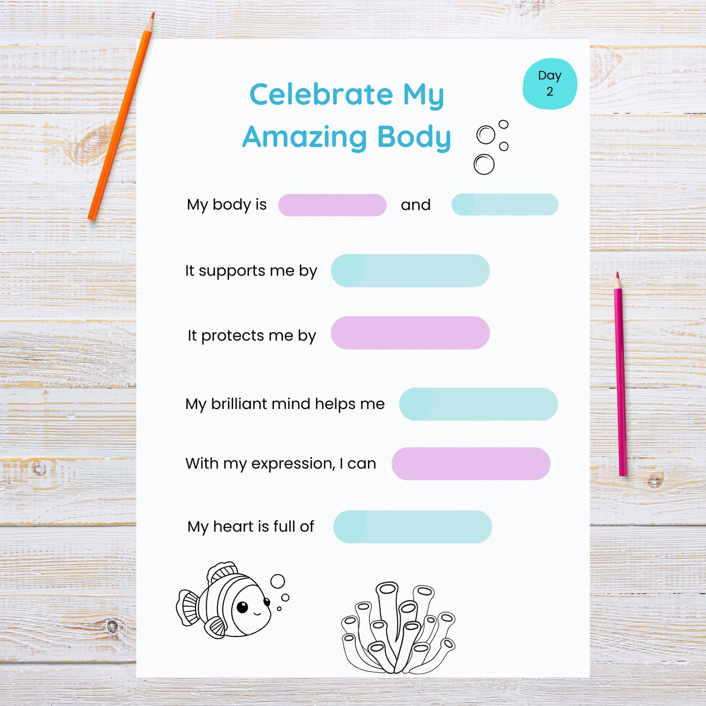 Worksheet titled 'Celebrate My Amazing Body' on a wooden surface with two pencils.